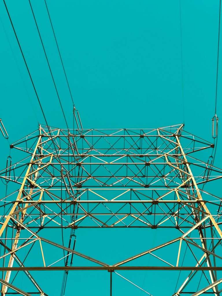 Power transmission tower against a blue sky